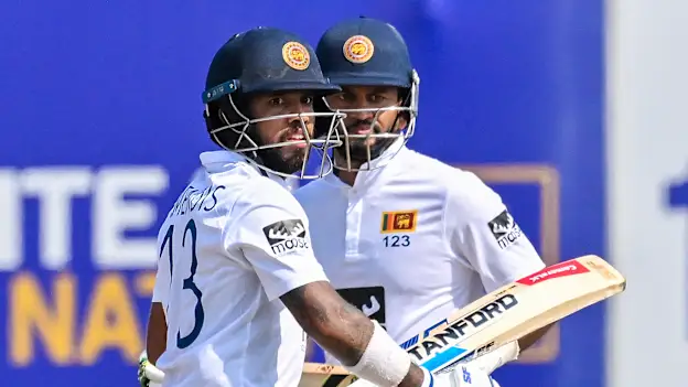 Sri Lanka's captain Dimuth Karunaratne (R) and Kusal Mendis run between the wickets during the first day of the first cricket Test match between Sri Lanka and Ireland 1920x1080