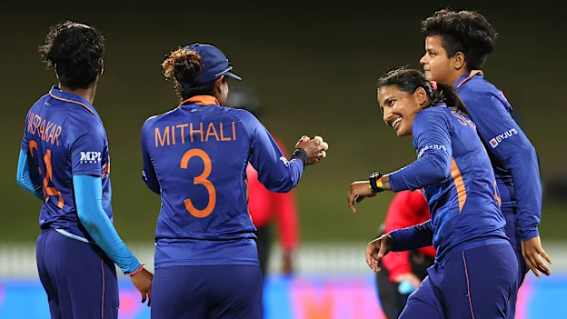 Sneh Rana of India celebrates with team mates after catching out Nahida Akter of Bangladesh during the 2022 ICC Women's Cricket World Cup match between India and Bangladesh at Seddon Park on March 22, 2022 in Hamilton, New Zealand.
