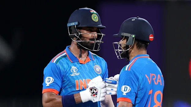 Virat Kohli (L) and KL Rahul of India interact during the ICC Men's Cricket World Cup India 2023 between India and Australia