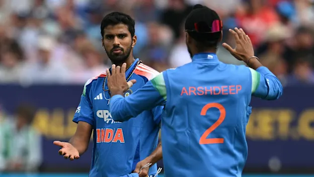 India's Arshdeep Singh (R) celebrates with India's Washington Sundar (L) after the latter took the catch to dismiss England's Jacob Bethell