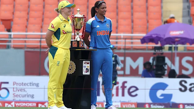 Alyssa Healy and Harmanpreet Kaur with the ODI series trophy