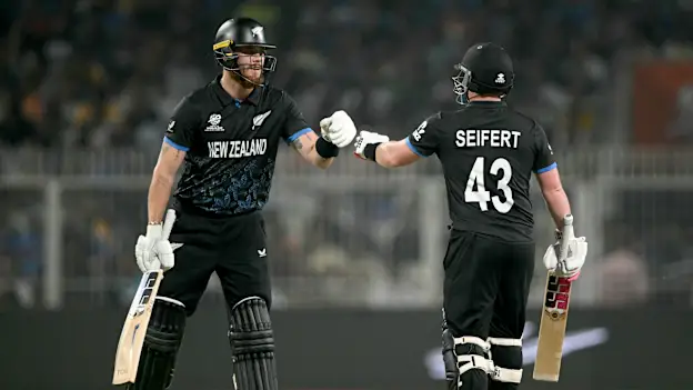 New Zealand's Finn Allen (L) and Tim Seifert (R) bump fists during the 2026 ICC Men's T20 Cricket World Cup semi-final match between New Zealand and South Africa at the Eden Gardens in Kolkata on March 4, 2026