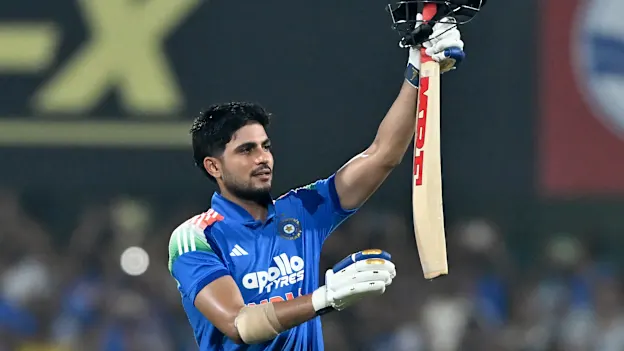 India's captain Shubman Gill celebrates after scoring a double-century (200 runs) during the second one-day international (ODI) cricket match between India and West Indies at the Barsapara Cricket Stadium in Guwahati