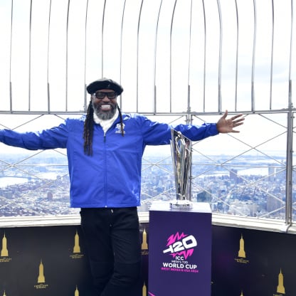 Chris Gayle at the top of the Empire State Building with the MT20WC Trophy