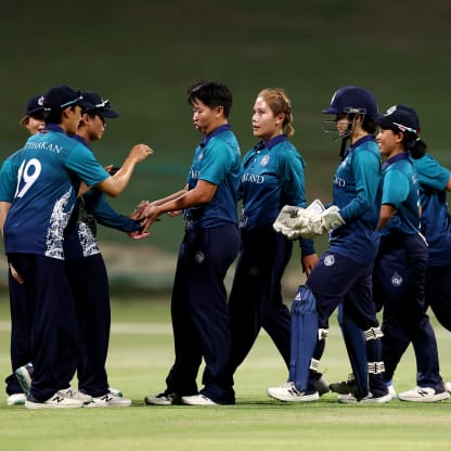 Players of Thailand celebrate taking the wicket of Gettika Kodali of USA