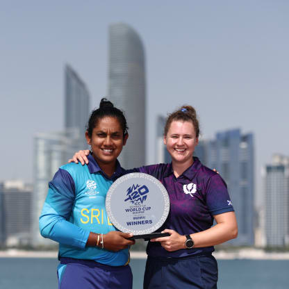 Chamari Athapaththu, captain of Sri Lanka and Kathryn Bryce, captain of Scotland pose with the trophy ahead of the ICC Women's T20 World Cup Qualifier 2024 final match between Sri Lanka and Scotland at Zayed Cricket Stadium on May 06, 2024 in Abu Dhabi, United Arab Emirates.