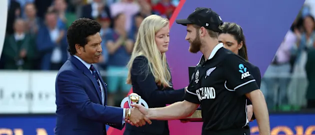 Kane Williamson the New Zealand captain receives the player of the tournament award from Sachin Tendulkar at the presentation ceremony.