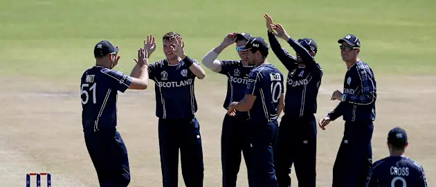Stuart Whittingham (2ndL) of Scotland celebrates with teamates after taking the wicket of Dipendra Airee of Nepal during the ICC Cricket World Cup Qualifier between Scotland v Nepal at Queens Sports Club on March 8, 2018 in Bulawayo, Zimbabwe (©ICC).