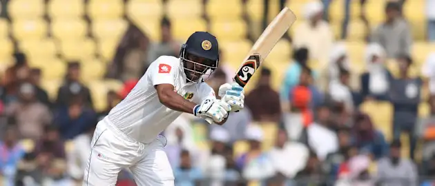 Dimuth Karunaratne scored a patient 147-ball 51 before being trapped leg before by Ishant Sharma.