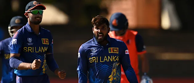 Wanindu Hasaranga of Sri Lanka celebrates the wicket of Teja Nidamanuru of Netherlands during the ICC Men's Cricket World Cup Qualifier