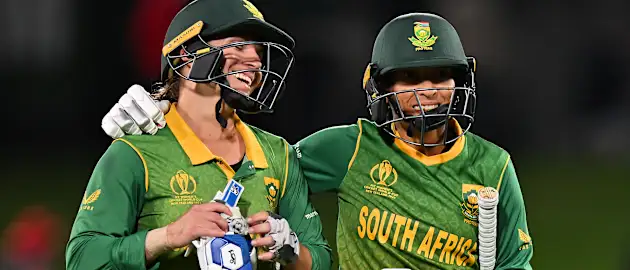 Shabnim Ismail and Mignon Du Preez of South Africa celebrate their victory during the 2022 ICC Women's Cricket World Cup match between India and South Africa at Hagley Oval on March 27, 2022 in Christchurch, New Zealand.