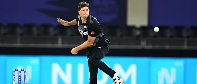 Mitchell Santner of New Zealand bowls during the ICC Men's T20 World Cup match between India and NZ at Dubai International Stadium on October 31, 2021 in Dubai, United Arab Emirates.