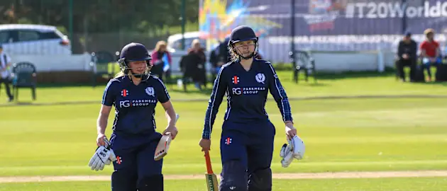 Lorna Jack and Sarah Bryce leave the field after leading Scotland to a 10 wicket win.