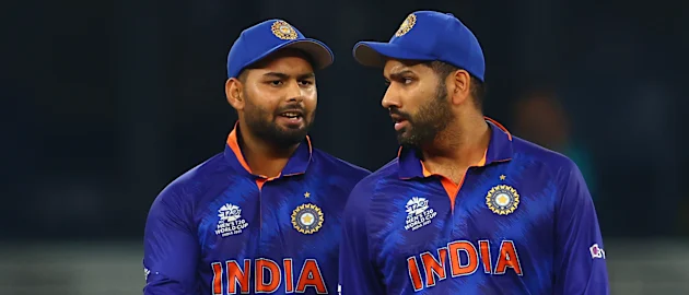 Rishabh Pant and Rohit Sharma of India interact during the ICC Men's T20 World Cup match between India and Pakistan 1920x1080