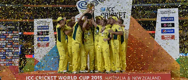 Australia's teammates celebrate with the trophy after victory against New Zealand during their 2015 Cricket World Cup final in Melbourne on March 29, 2015.