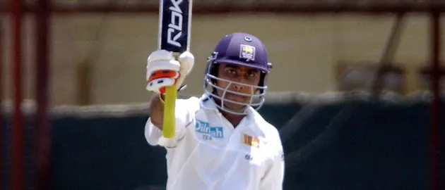 Jayawardene raises his bat after reaching his century in his epic knock of 123 against South Africa