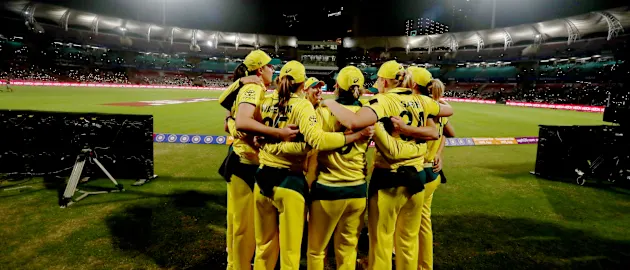 Players of Australia have a team talk huddle before the start of the Women's T20I match between India and Australia at DY Patil Stadium