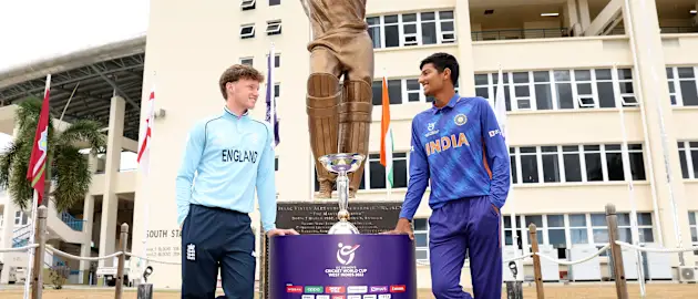 Tom Prest of England and Yash Dhull of India pose with the ICC U19's Men's World Cup Trophy ahead of the ICC U19 Men's Cricket World Cup Final match between England and India at Sir Vivian Richards Stadium on February 04, 2022 in Antigua.