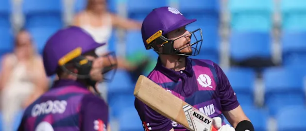 Scotland's Michael Jones (R) watches his shot over the boundary line for six runs during the ICC mens Twenty20 World Cup 2022 cricket match between Ireland and Scotland 1920x1080