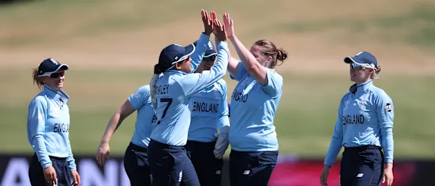 Anya Shrubsole (2R) of England celebrates with teammates after dismissing Mithali Raj of India during the 2022 ICC Women's Cricket World Cup match between England and India at Bay Oval on March 16, 2022 in Tauranga, New Zealand.