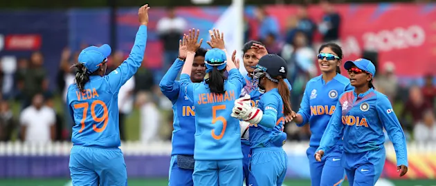 India players celebrate the wicket of Katey Martin of New Zealand during the ICC Women's T20 Cricket World Cup match between India and New Zealand at Junction Oval on February 27, 2020 in Melbourne, Australia.