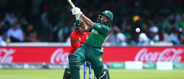 Imam Ul-Haq of Pakistan plays a shot as Mushfiqur Rahim of Bangladesh looks on during the Group Stage match of the ICC Cricket World Cup 2019 between Pakistan and Bangladesh at Lords on July 05, 2019 in London, England.