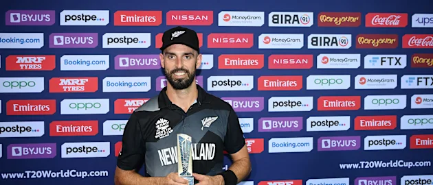 Daryl Mitchell of New Zealand poses after being named Player of the Match following the ICC Men's T20 World Cup semi-final match between England and New Zealand at Sheikh Zayed stadium on November 10, 2021 in Abu Dhabi, United Arab Emirates.