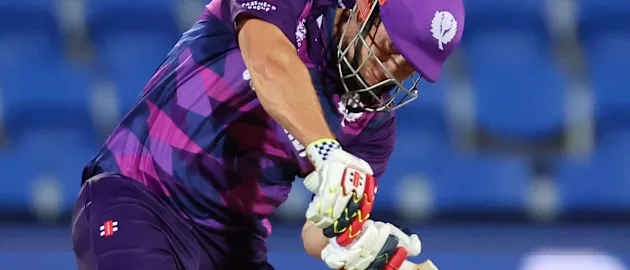 Scotland's George Munsey (L) plays a shot watched by Zimbabwe's wicketkeeper Regis Chakabva during the ICC mens Twenty20 World Cup 2022