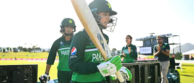 Bismah Maroof (R) and Diana Baig of Pakistan leaves the field at the end of the innings during the 2022 ICC Women's Cricket World Cup match between Australia and Pakistan at Bay Oval on March 08, 2022 in Tauranga, New Zealand.
