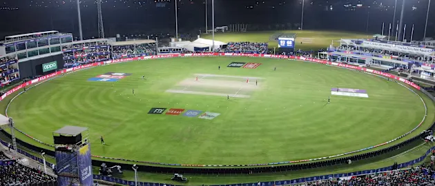 This areal view shows cricketers playing during the ICC men's Twenty20 World Cup cricket match between Oman and Bangladesh at the Oman Cricket Academy Ground in Muscat on October 19, 2021.