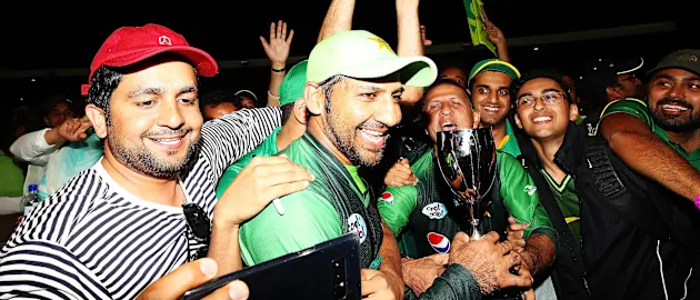 Sarfraz Ahmed celebrates with the Pakistan fans following his side's win in Tauranga