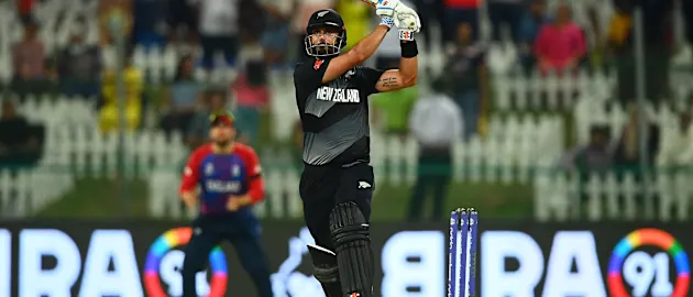 Daryl Mitchell of New Zealand plays a shot during the ICC Men's T20 World Cup semi-final match between England and New Zealand at Sheikh Zayed stadium on November 10, 2021 in Abu Dhabi, United Arab Emirates.