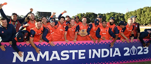 Players and Staff of Netherlands celebrate after beating Scotland to qualify for the World Cup following the ICC Men's Cricket World Cup Qualifier Zimbabwe 2023 Super 6 match between Scotland and Netherlands at Queen’s Sports Club on July 06, 2023.