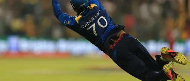 Gunathilaka dives for a catch