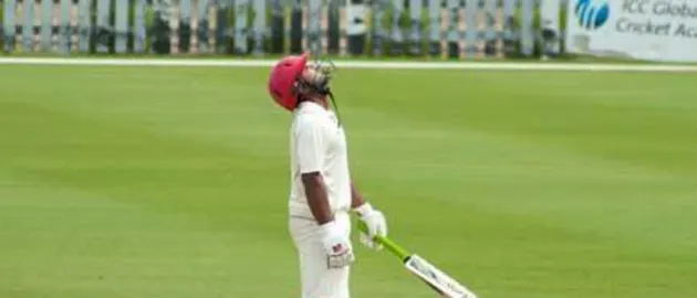 43953 Hiral Patel looks up after completing his half-century