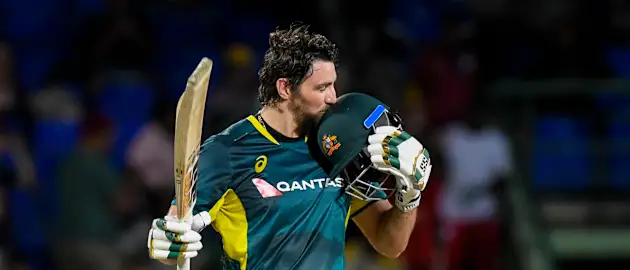 Australia's Tim David celebrates after reaching his maiden T20I century