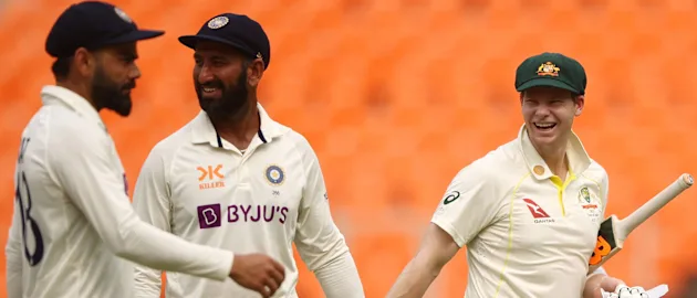 Steve Smith (right) shares a joke with Virat Kohli (left) and Cheteshwar Pujara (centre)