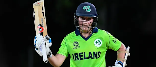Clare Shillington of Ireland celebrates her half century during a warm-up match at Coolidge Cricket Ground on November 7, 2018 in Coolidge, Antigua and Barbuda.