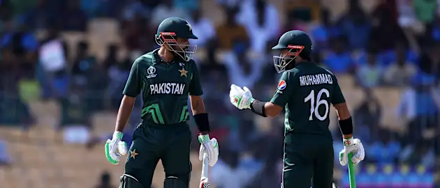 Babar Azam and Mohammad Rizwan of Pakistan interact during the ICC Men's Cricket World Cup India 2023 between Pakistan and South Africa