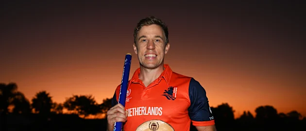 Logan van Beek of Netherlands pose for a photo while holding a match stump and the Player of the Match award after winning the ICC World Cup Qualifier Zimbabwe 2023 match between the West Indies and Netherlands at Takashinga Cricket Club on June 26, 2023.
