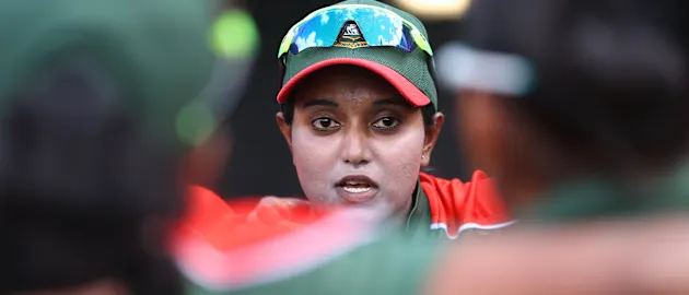 Bangladesh captain Nigar Sultana talks to her players before the 2022 ICC Women's Cricket World Cup match between India and Bangladesh at Seddon Park on March 22, 2022 in Hamilton, New Zealand.