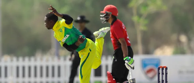Sylvester Okpe bowls against Hong Kong