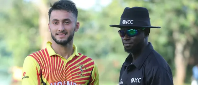 Player of the match Riazat Ali Shah receives his award from Nigerian umpire Kehinde Olanbiwonnu  (1)