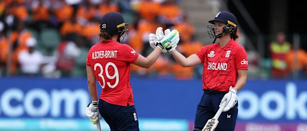 Nat Sciver-Brunt of England celebrates their half century with team mate Amy Jones during the ICC Women's T20 World Cup group B match between England and India at St George's Park on February 18, 2023 in Gqeberha, South Africa.