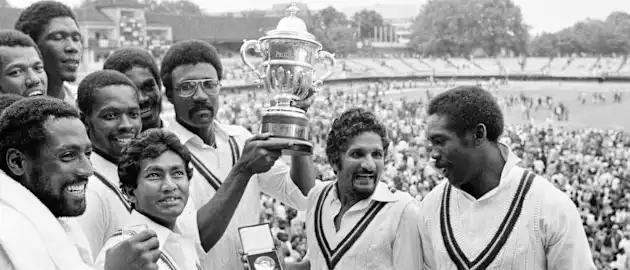 West Indies captain Clive Lloyd holds aloft the World Cup trophy after victory in the final over England in 1979