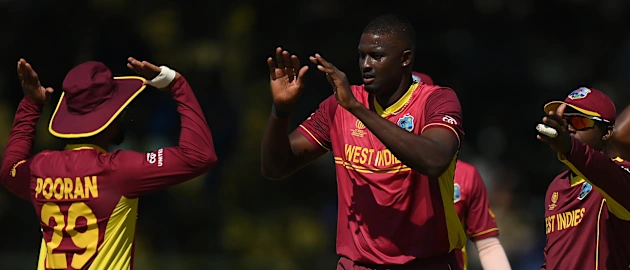 Jason Holder of West Indies celebrates the wicket of Chris McBride of Scotland during the ICC Men's Cricket World Cup Qualifier Zimbabwe 2023 Super 6 match between Scotland and West Indies (2)