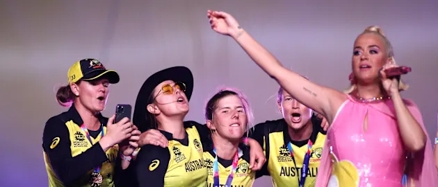 Australia's players celebrate with Katy Perry.