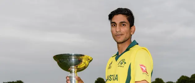 Australia captain Jason Sangha poses with the ICC U19 World Cup trophy during the 2018 event's opening ceremony