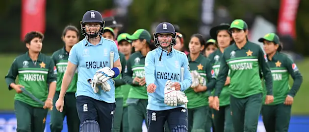 Heather Knight  and Danni Wyatt of England leave the field during the 2022 ICC Women's Cricket World Cup match between England and Pakistan at Hagley Oval on March 24, 2022 in Christchurch, New Zealand.