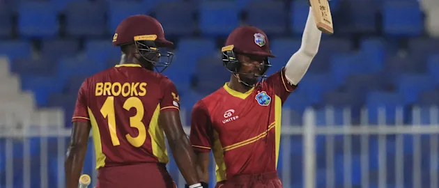 West Indies' Alick Athanaze (R) celebrates after scoring a half-century (50 runs) during the third one-day international (ODI) cricket match between the United Arab Emirates and West Indies 1920x1080